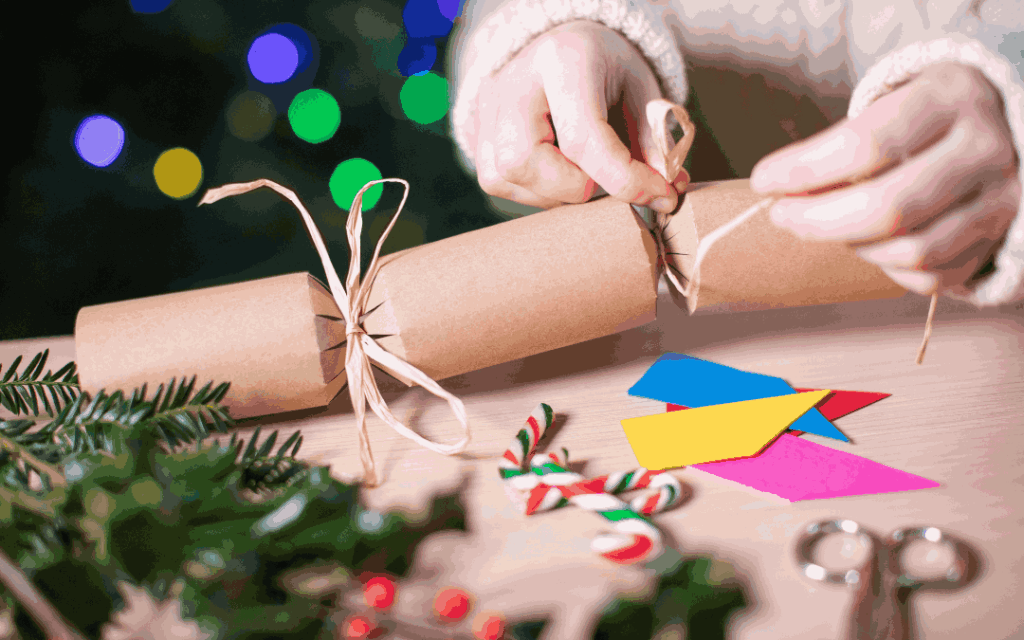 a photo displaying someone making their own christmas cracker